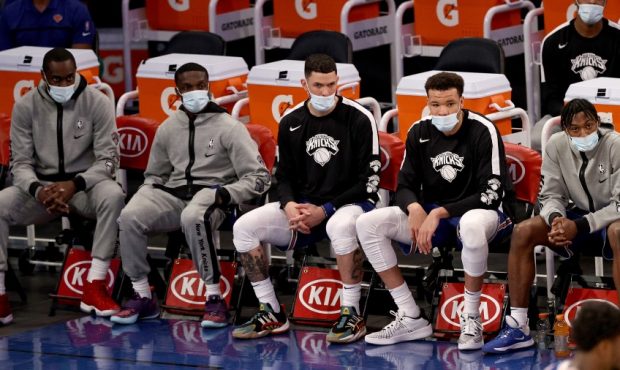 Members of the New York Knicks wear masks due to safety protocols from the NBA (Photo by Elsa/Getty...