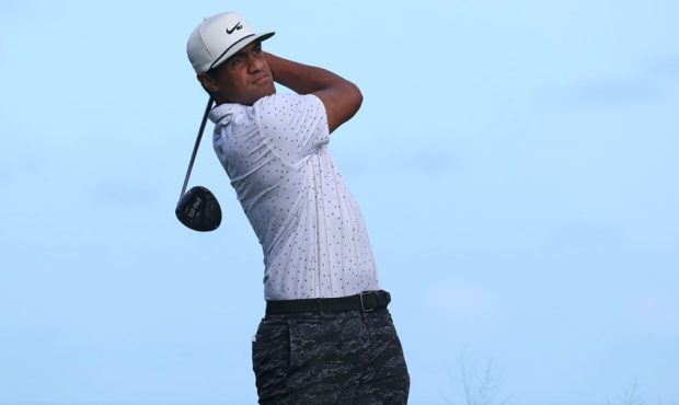 Tony Finau of the United States watches his drive on the 16th hole during a practice round for the ...