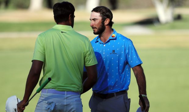 Max Homa of the United States shakes hands with Tony Finau of the United States after defeating him...
