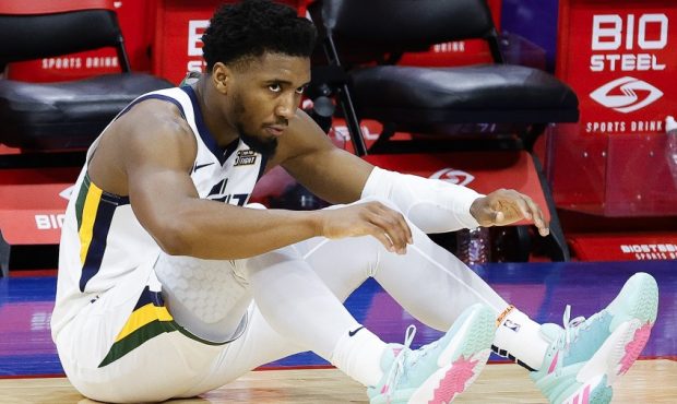Utah Jazz guard Donovan Mitchell sits on the floor (Photo by Tim Nwachukwu/Getty Images)...
