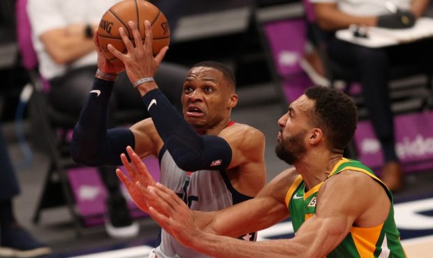 Russell Westbrook of the Washington Wizards attacks Rudy Gobert of the Utah Jazz (Photo by Patrick ...