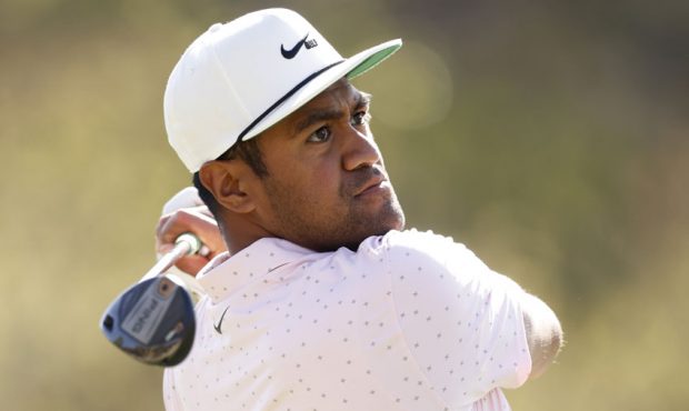 Tony Finau of the United States and plays his shot on the third tee in his match against Jason Kokr...