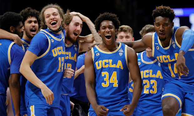 INDIANAPOLIS, INDIANA - MARCH 28: David Singleton #34 of the UCLA Bruins celebrates with Kenneth Nw...