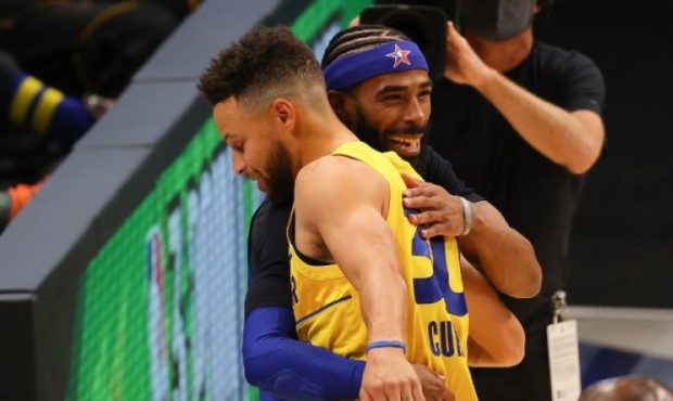 Mike Conley of the Utah Jazz hugs Steph Curry of the Golden State Warriors at the NBA All-Star Game...