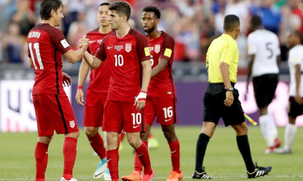 Alejandro Bedova #11 and Christian Pulisic #10 of the U.S. National Team celebrate their win over T...