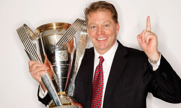Real Salt Lake team owner Dave Checketts poses with the Philip F. Anschutz MLS Cup trophy following...