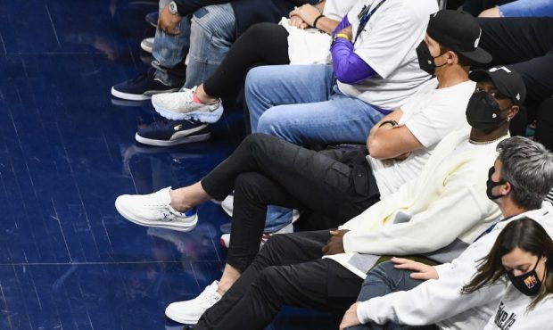 Utah Jazz owners Ryan Smith and Dwyane Wade sit courtside...