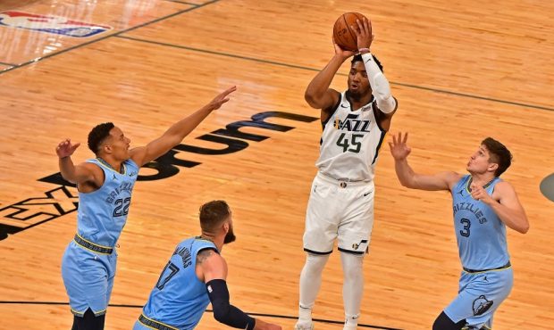 Utah Jazz guard Donovan Mitchell shoots over the Memphis Grizzlies (Photo by Justin Ford/Getty Imag...
