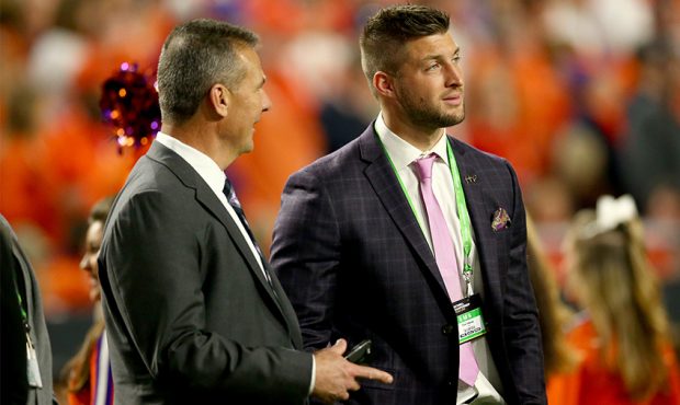 GLENDALE, AZ - JANUARY 11: Urban Meyer talks with Tim Tebow during the 2016 College Football Playof...