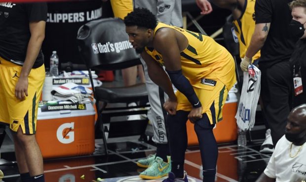 Donovan Mitchell stands on the sidelines as the Utah Jazz face the Los Angeles Clippers in game fou...