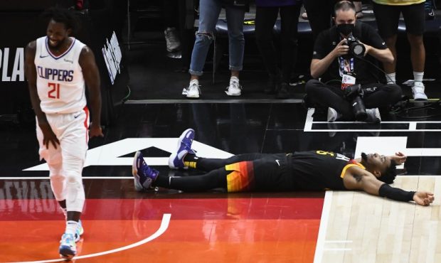 Donovan Mitchell lays on the floor in the Utah Jazz loss to the Los Angeles Clippers (Photo by Alex...