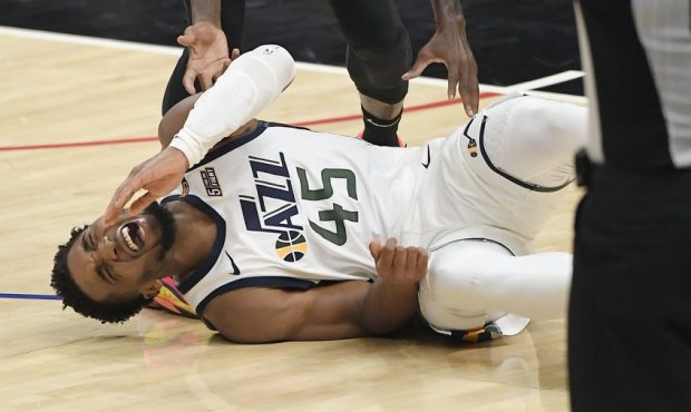 Utah Jazz guard Donovan Mitchell lays injured against the Los Angeles Clippers (Photo by Kevork Dja...