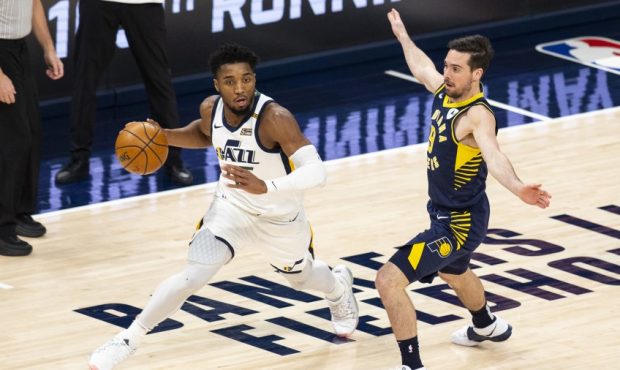 Donovan Mitchell of the Utah Jazz defended by TJ McConnell of the Indiana Pacers (Photo by Lauren B...