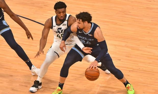 Utah Jazz guard Donovan Mitchell defends Memphis Grizzlies guard Dillon Brooks (Photo by Justin For...