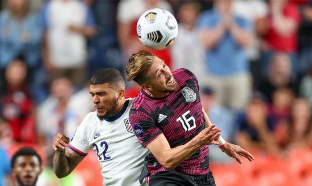 DeAndre Yedlin #22 of the United States and Hector Herrera #16 of Mexico battle during the CONCACAF...