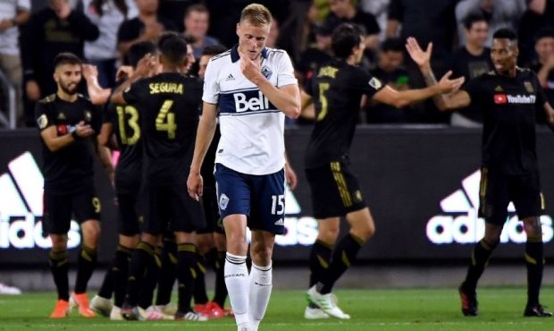 Andy Rose #15 of Vancouver Whitecaps reacts after a goal from Carlos Vela #10 of Los Angeles FC to ...