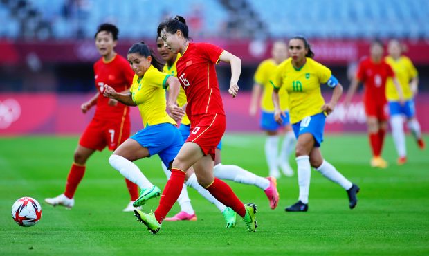 RIFU, MIYAGI, JAPAN - JULY 21: Man Yang #15 of Team China passes the ball during the Women's First ...