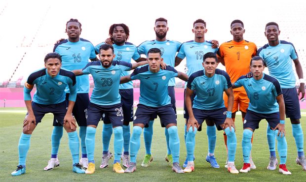 KASHIMA, JAPAN - Players of Team Honduras pose for a team photograph prior to the Men's First Round...