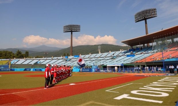 FUKUSHIMA, JAPAN - JULY 21: A general view of Team Australia and Team Japan standing in the infield...