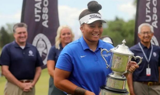 Lila Galea’i holds the trophy after winning the final round of the Women’s State Am golf tourna...