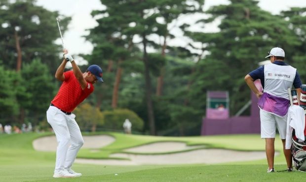 Xander Schauffele of Team United States plays a shot on the 12th hole during the second round of th...