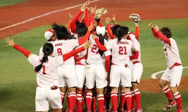 Team Japan celebrates after defeating Team United States 2-0 in the Softball Gold Medal Game...