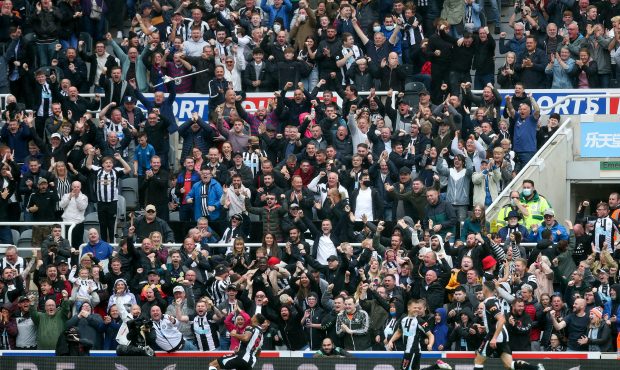 NEWCASTLE UPON TYNE, ENGLAND - AUGUST 15: Fans of Newcastle United celebrate their side's first goa...