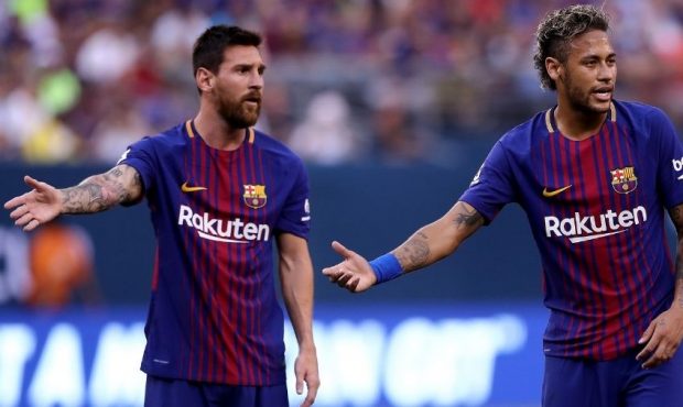 Lionel Messi #10 and Neymar #11 of Barcelona react to the way Juventus lined up for a kick in the f...