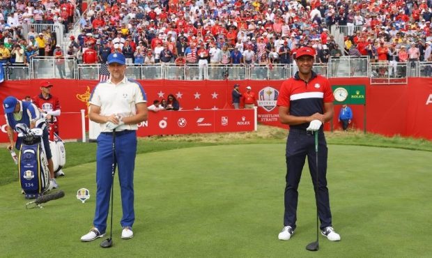 Ian Poulter of England and team Europe and Tony Finau of team United States pose for a photo on the...