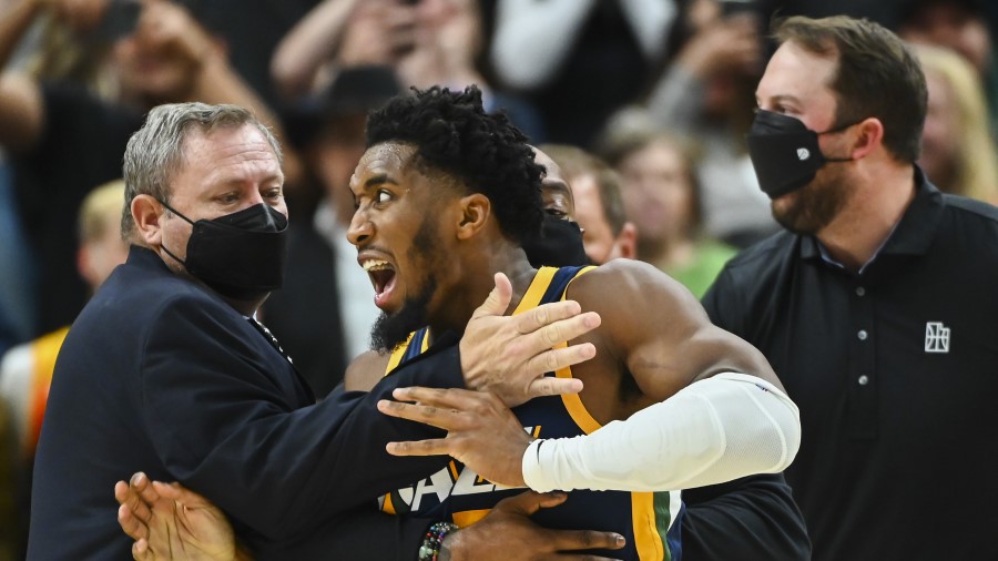 Utah Jazz guard Donovan Mitchell being held back during a scuffle with the Indiana Pacers (Photo by...