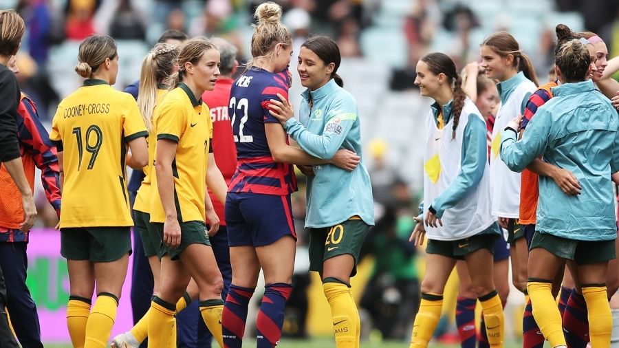 Sam Kerr of the Matildas embraces Kristie Mewis of the United States during game one of the series ...