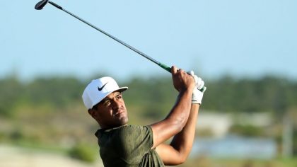 Tony Finau of the United States follows his second shot into the 18th hole during the final round o...