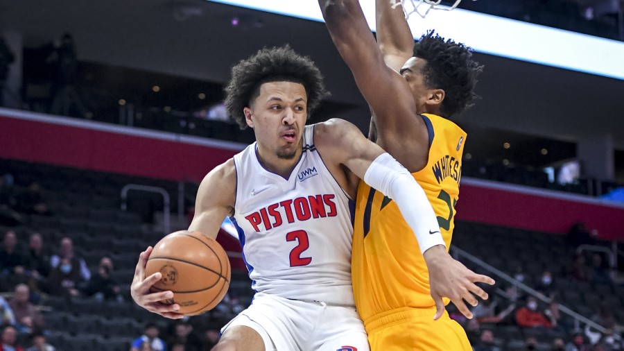 Detroit Pistons guard Cade Cunningham defended by Utah Jazz center Hassan Whiteside. (Photo by Nic ...