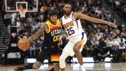 Utah Jazz guard Jordan Clarkson drives against Phoenix Suns forward Mikal Bridges (Photo by Alex Go...