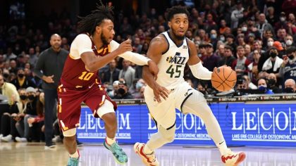Utah Jazz guard Donovan Mitchell defended by Cleveland Cavaliers guard Darius Garland (Photo by Jas...