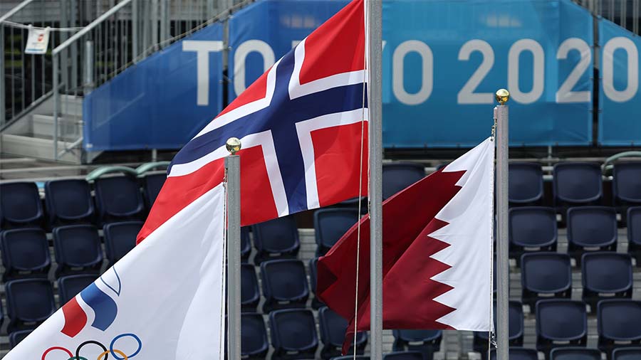 TOKYO, JAPAN - AUGUST 07: The flags for Team ROC, Norway and Qatar fly during the medal ceremony fo...