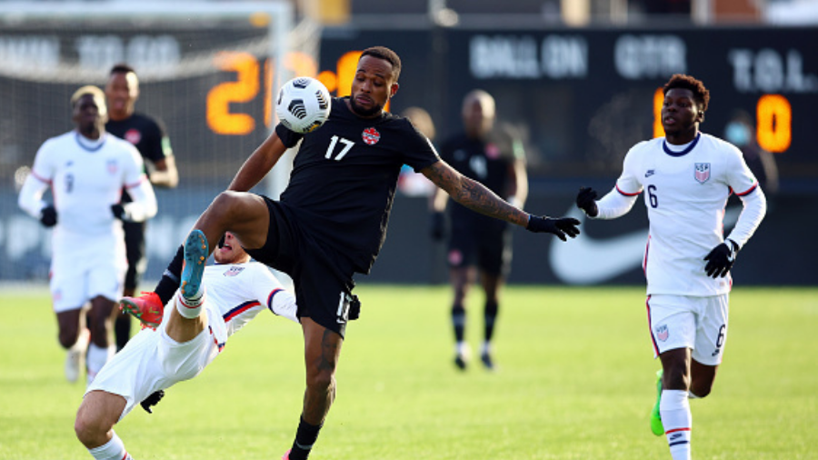 HAMILTON, ON - JANUARY 30: Cyle Larin #17 of Canada and Sergiño Dest #2 of the United States battl...