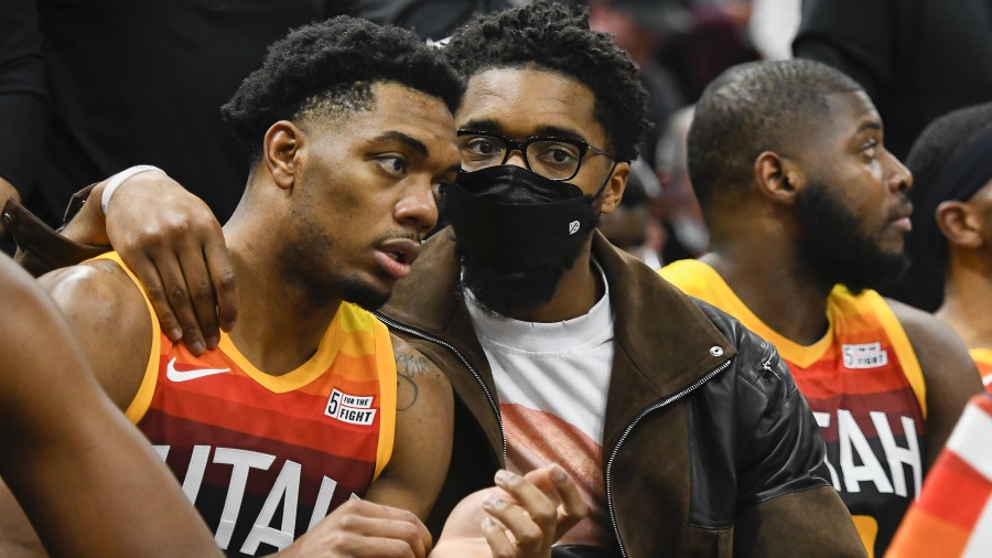 Utah Jazz guards Donovan Mitchell and Trent Forrest talk on the bench (Photo by Alex Goodlett/Getty...