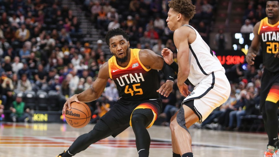 Utah Jazz guard Donovan Mitchell defended by the Brooklyn Nets (Photo by Chris Gardner/Getty Images...