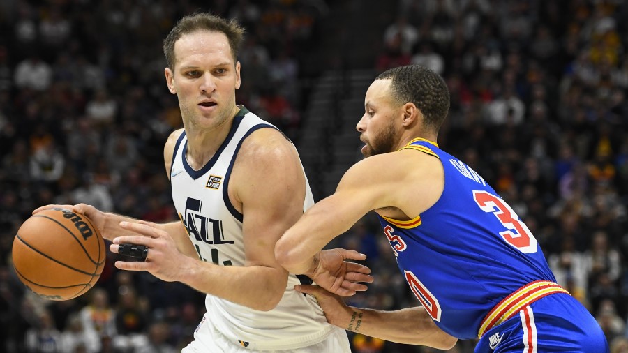 Utah Jazz forward Bojan Bogdanovic defended by Golden State Warriors guard Steph Curry (Photo by Al...