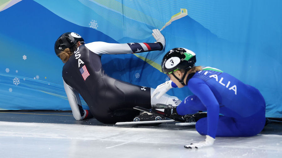 Arianna Fontana of Team Italy and Kristen Santos of Team United States fall during the Women's 1000...