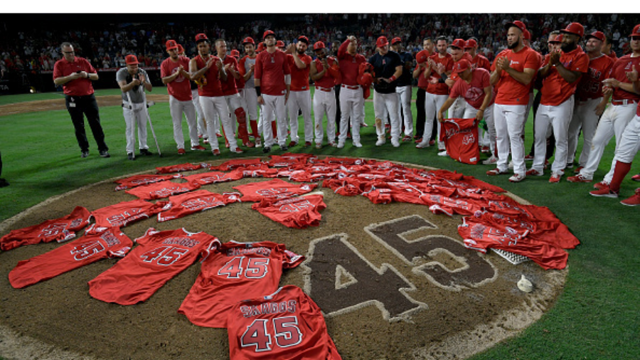ANAHEIM, CA - JULY 12: Los Angeles Angels of Anaheim players lay their jerseys on the pitchers moun...