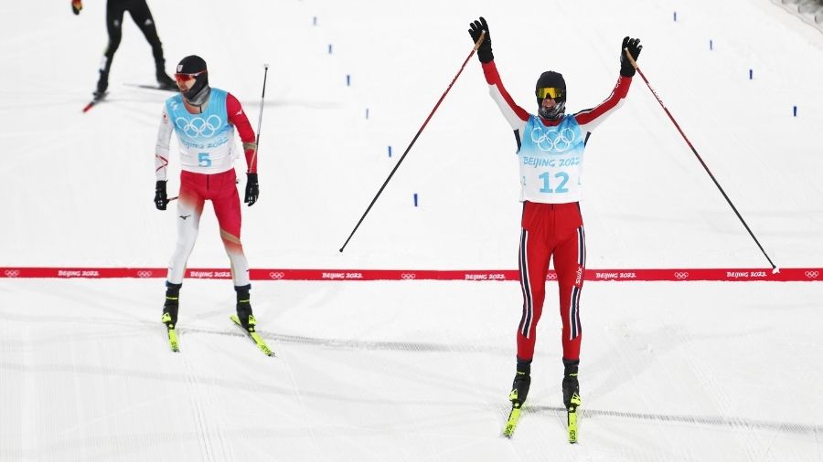 Joergen Graabak of Team Norway celebrates winning the Gold medal as Bronze medal winner Akito Watab...