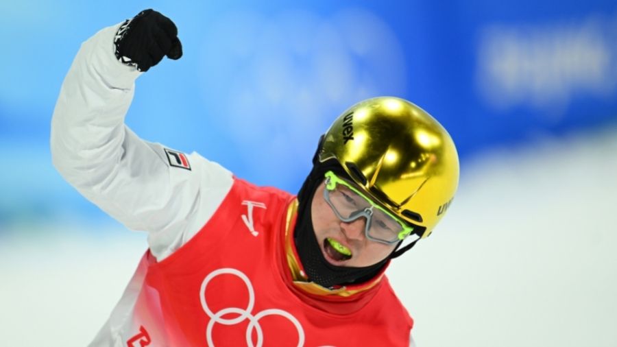 Qi Guangpu of Team China reacts after completing a run during the Men's Freestyle Skiing Aerials Fi...