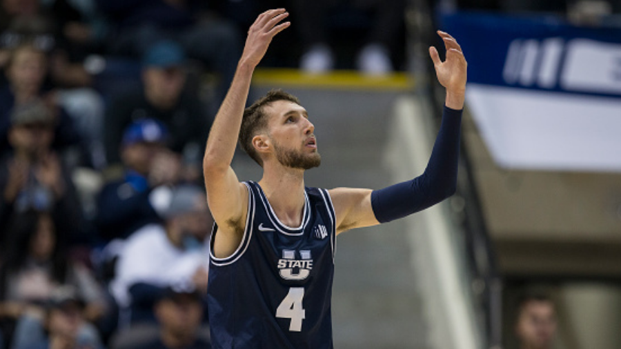 SALT LAKE CITY, UT - DECEMBER 8: Brandon Horvath #4 of the Utah State Aggies reacts at being called...