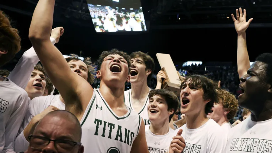 Olympus celebrates their 5A boys basketball state championship win against Woods Cross at BYU in Pr...