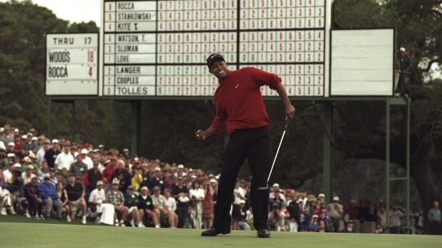 Tiger Woods of the USA celebrates after sinking a 4 feet putt to win the US Masters at Augusta, Geo...
