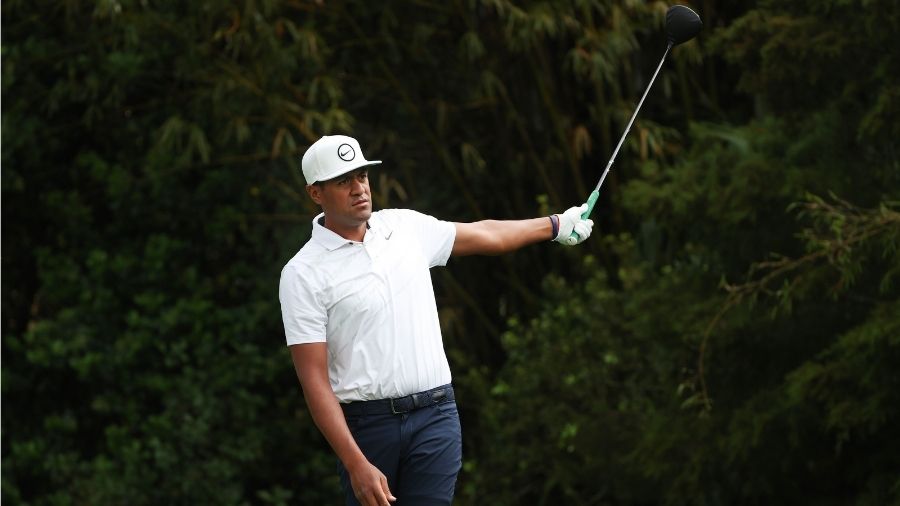 Tony Finau of the United States reacts to his shot from the 11th tee during the first round of THE ...