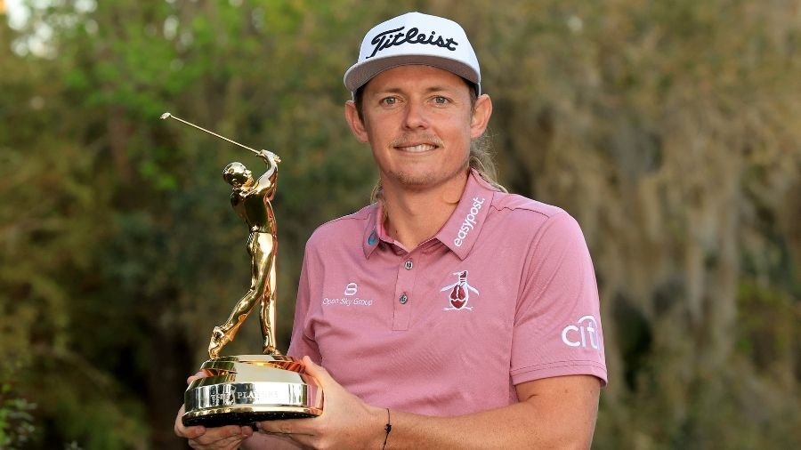 Cameron Smith of Australia holds the trophy after his one-shot win during the final round of THE PL...