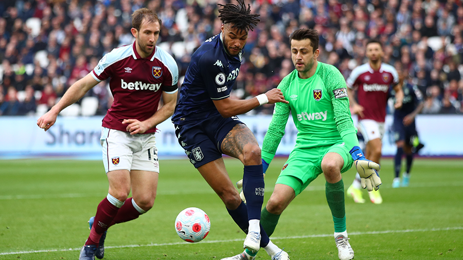LONDON, ENGLAND - MARCH 13: Tyrone Mings of Aston Villa in action with Craig Dawson and Lukasz Fabi...